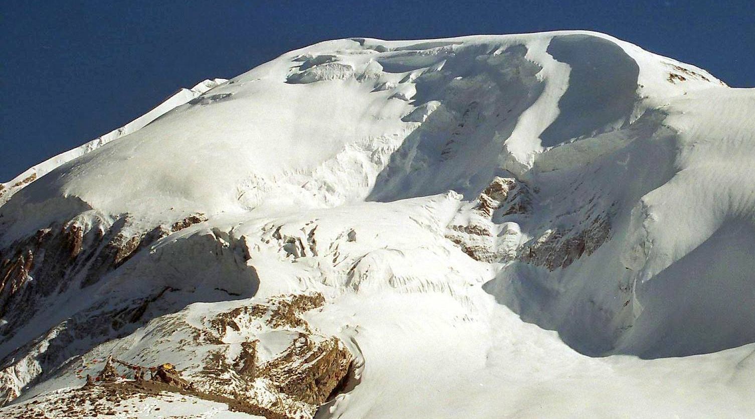 Tharong Peak ( Thorong Ri ) above Tharong La on crossing Tharong La high pass on Annapurna circuit trek in the Nepal Himalaya