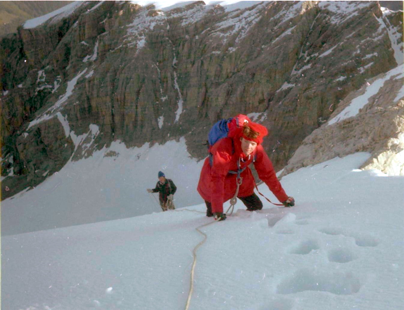 Climbing upper snow slopes above rock tower on ascent of the Ortler ( Cima Ortles )