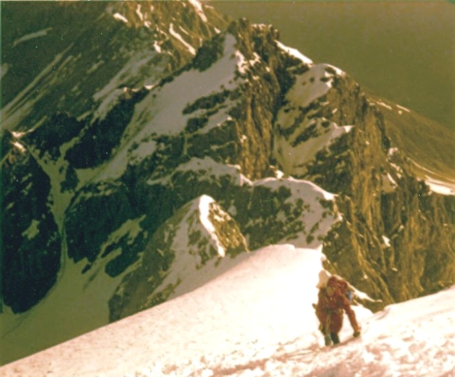 Climbing upper snow slopes above rock tower on ascent of the Ortler ( Cima Ortles )